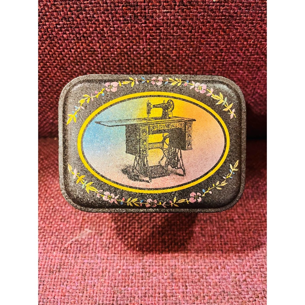Vintage Singer sewing tin container with old buttons